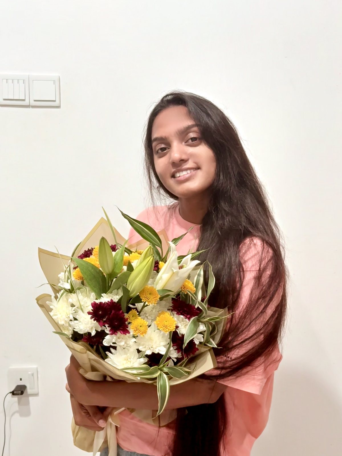 Muthu holding a beautiful bouquet