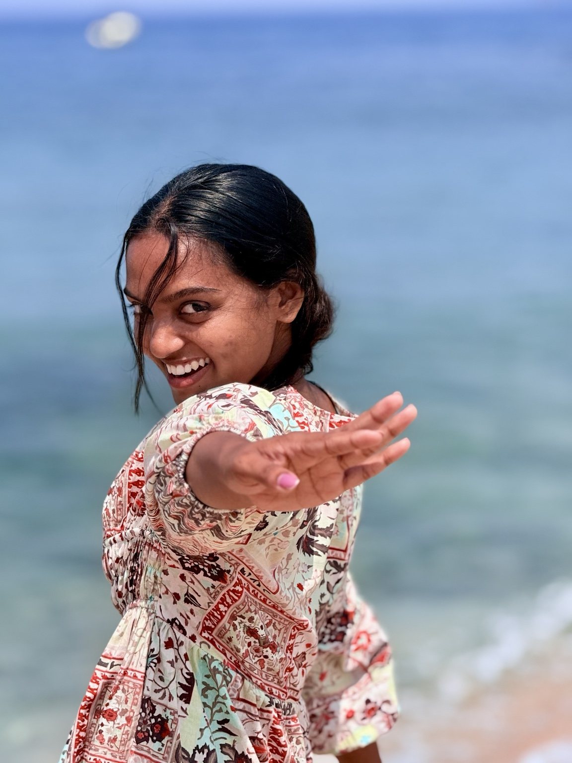 Muthu enjoying a playful seaside moment